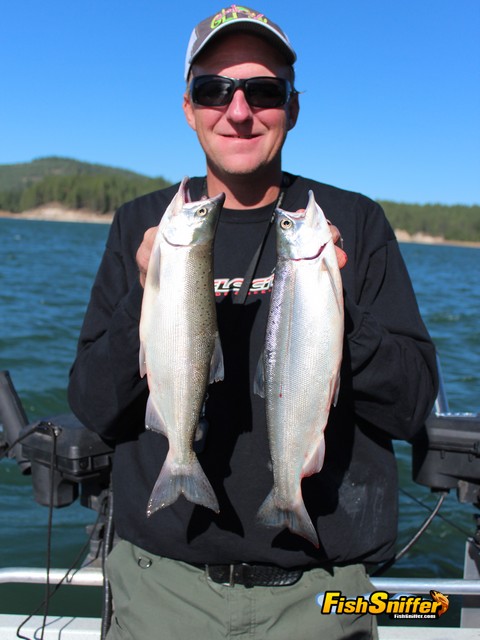 Captain James Netzel of Tight Lines Guide Service shows off a couple of kokanee caught while trolling at Boca Reservoir on July 18.