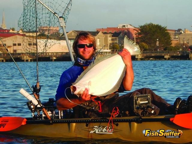 Matt Mayes was all smiles after putting this impressive 33.5 inch Humboldt Bay halibut into his kayak.