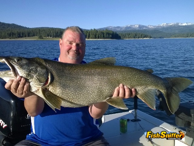 Bill Hayes shows off a huge mackinaw that he caught while trolling guide and tackle manufacturer Ken Mathis.