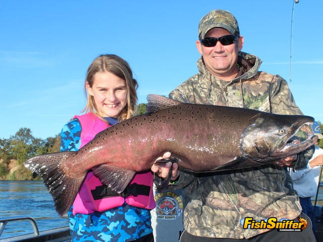  Jeff Bosshard and his daughter, Vivica, pose proudly with the huge king salmon that she landed while fishing the Feather River below the Thermalito Afterbay Outlet with Robert Weese of Northern California Guide Service.