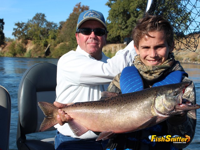 Captain Robert Weese and “birthday boy” Greyson Bosshard show off a bright Chinook salmon caught on salmon roe on the Feather River.