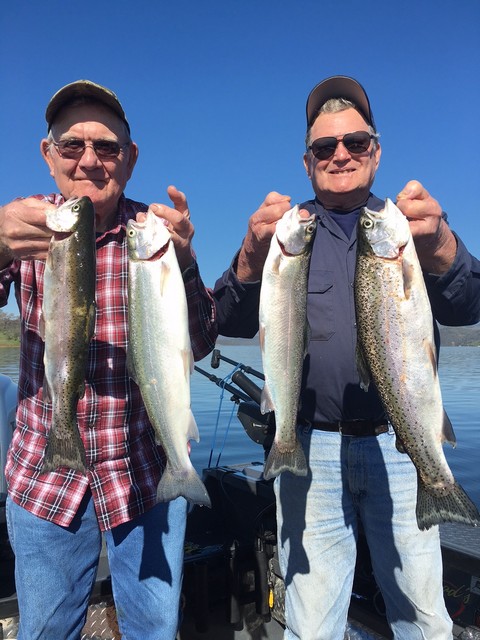 Don Smith and Butch Betschart show off a quartet of quality Don Pedro Reservoir rainbows that they landed during a March trolling adventure.