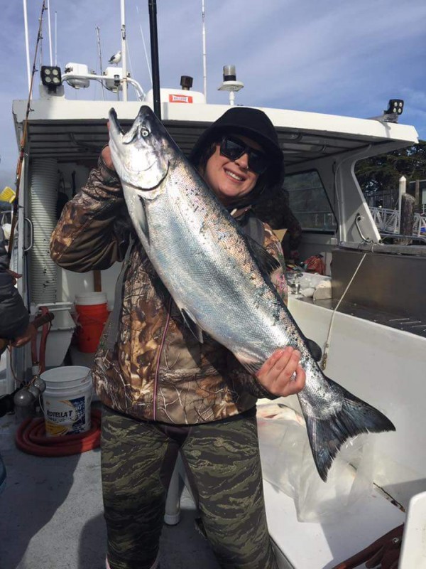 This woman successfully battled this big Chinook salmon while trolling outside the Golden Gate with the New Easy Rider.