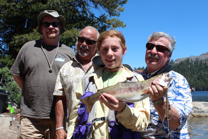 rteen-year-old Cecily Greenberg won the biggest fish award by catching a 20 inch rainbow weighing 2 pounds on PowerBait during the Lake Alpine Kid’s Fishing Day on July 15. Behind her from left to right: Donald Connor, Bruno Huff and Stephan Krayk, all members of the Alpine County Fish and Game Commission. 